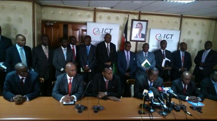 Image of government officers at a press briefing