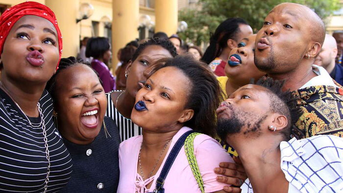 Members of LGBTQ community take a selfie at the High Court on February 22, 2019, during landmark ruling on the decriminalisation of same-sex in Kenya