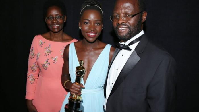 Lupita's father and mother after she scooped an Oscars award in 2014
