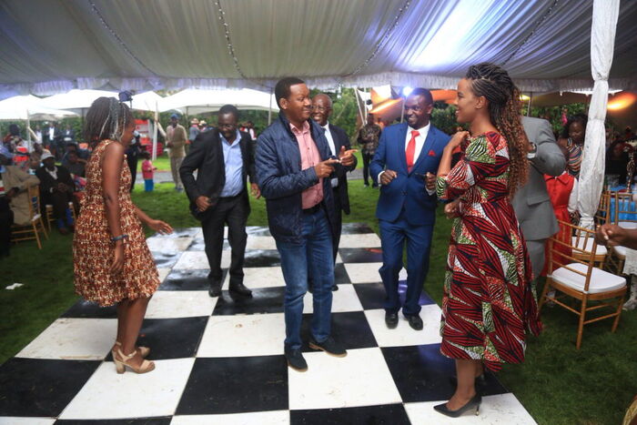 Machakos Governor Alfred Mutua enjoying a hearty moment with his wife Lillyanne at Fred Obachi Machoka's wedding celebration, December 7, 2019.
