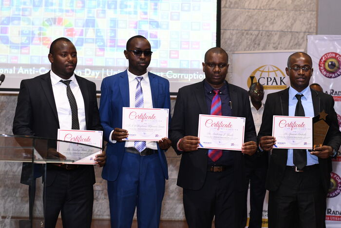 Mara Heist whistleblowers posing with their certificates after being awarded the Whistleblowers award by the 