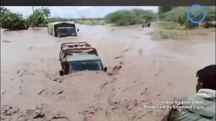A screen grab of the video  showing KDF officers crossing the flooded river on Friday October 18