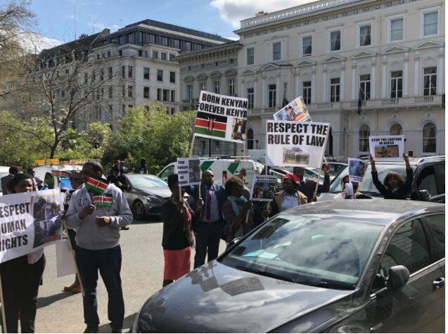 Protesters demonstrate against President Uhuru Kenyatta outside Chatham House in London on April 17, 2018