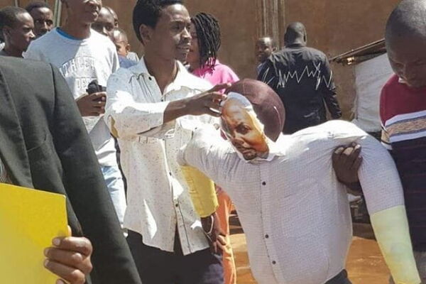 Gatundu South residents demonstrate while carrying placards and Kuria's effigy on Wednesday, December 18, 2019