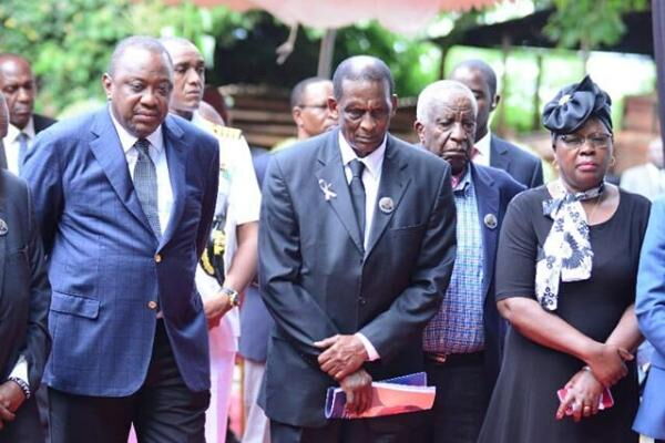 President Uhuru Kenyatta (l) and Alice Wahome (r), pay their last respects to former Cabinet Minister Charles Rubia on Monday, December 30, 2019, in Kandara, Murang'a County