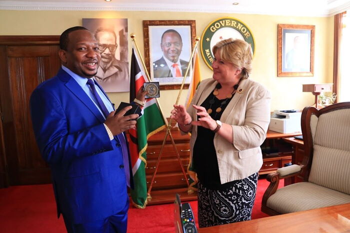 Victoria Wallace, the Director-General of the Commonwealth War Graves Commission hands Nairobi Governor Mike Sonko a special commendation seal, December 2.