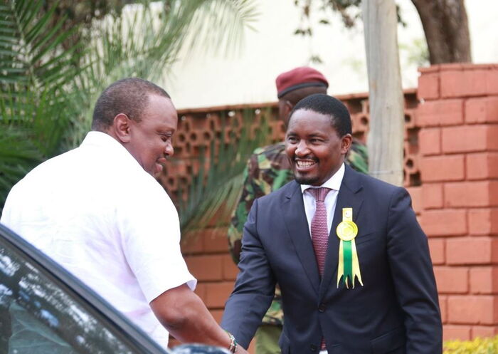 A past photo of former Agriculture CS Mwangi Kiunjuri and President Uhuru Kenyatta