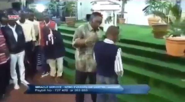 A screenshot of Pr. Ng'ang'a raining slaps on a boy in his church in a past Sunday service.