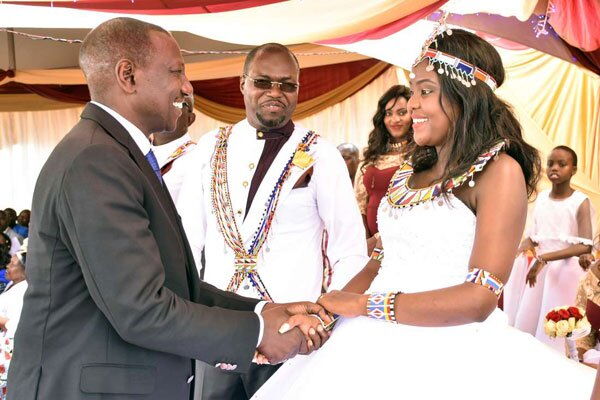 Deputy President William Ruto with the newly-wedded couple Johana Ngeno and his wife Naiyanoi Ntutu in Narok County on August 18, 2018. Ng'eno on Wednesday, November 20, 2019, alleged that Uhuru Kenyatta wanted to stay in power through BBI