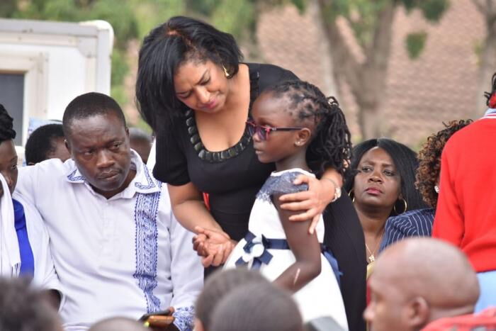 Esther Passaris condoling a pupil during the requiem mass at Precious Talent Primary school that was held on September 27, 2019. Photo: Daily Nation.