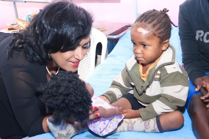Esther Passaris donating a doll to a young patient at Kenyatta National Hospital. Photo: Facebook.