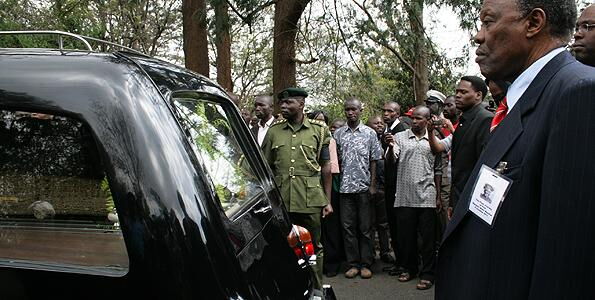Mwangi Mathai, escorts the hearse carrying the remains of his ex-wife from the Lee Funeral Home on October 8, 2011.