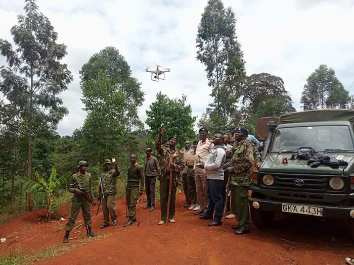 Police in Murang'a launch a drone as they conduct a search for illicit brewers