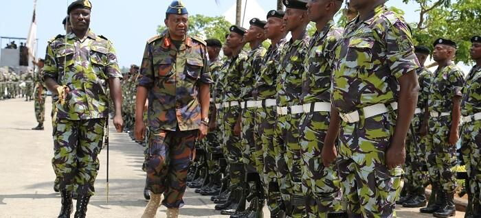 President Uhuru Kenyatta inspects a guard of honour mounted by Kenya Navy personnel during the Kenya Navy @ 50 celebrations on 15th December 2014 at Mtongwe base.