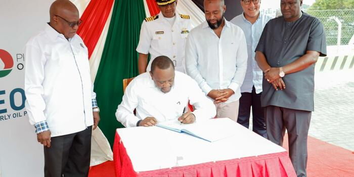 President Uhuru Kenyatta pictured signing several documents at Kipevu Oil Terminal August 26, 2019 