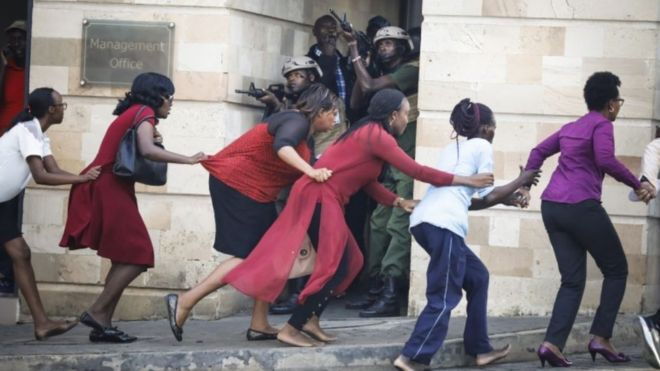 Victims of the DusitD2 attack being rescued by police.