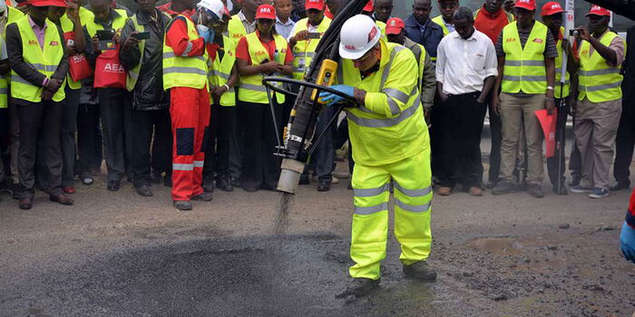 An engineer participates in road construction on Ngong road Dagoretti Corner roundabout on February 9, 2016.