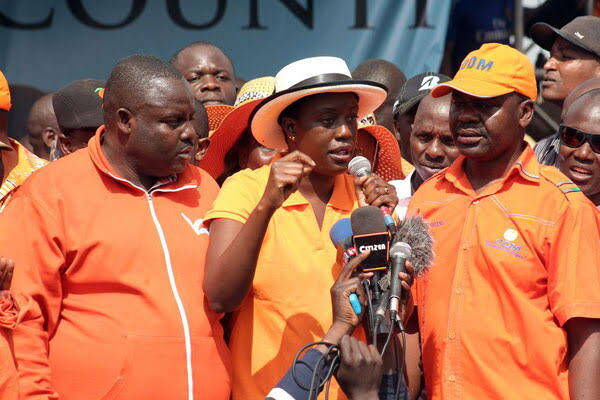 Rosemary Odinga (centre) with George Aladwa (left), who is the chairman of the Nairobi branch of the Orange Democratic Movement, and Tom Kajwang', the Member of Parliament for Ruaraka, in Huruma, Nairobi on September 18, 2016.