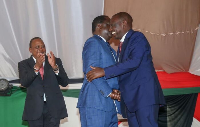 AU Envoy Raila Odinga and Deputy Resident William Ruto embrace during a past state function in Nairobi.