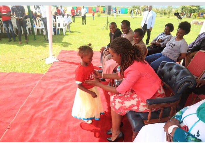 Machakos First Lady Lilian Ng'ang'a shares a moment with children at the Machakos People's Park on Friday, December 21.
