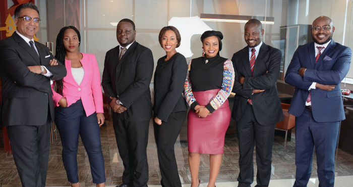 Valentine Khaminwa (centre) with colleagues at the Conrad Law