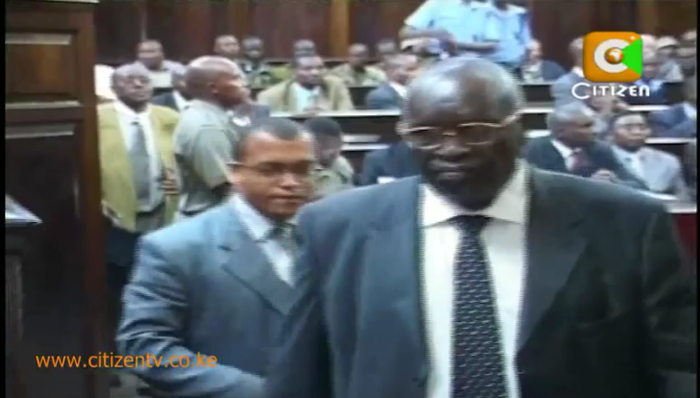 The highly reclusive John Ngata Kariuki (in glasses) leaves the court on August 26, 2011, after the high court nullified his election as Kirinyaga MP.