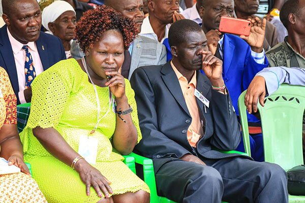 Melida Auma and Douglas Otieno in a pensive mood during the burial of their daughter Sharon Otieno in Magare village, Homa Bay County, on October 19, 2018.