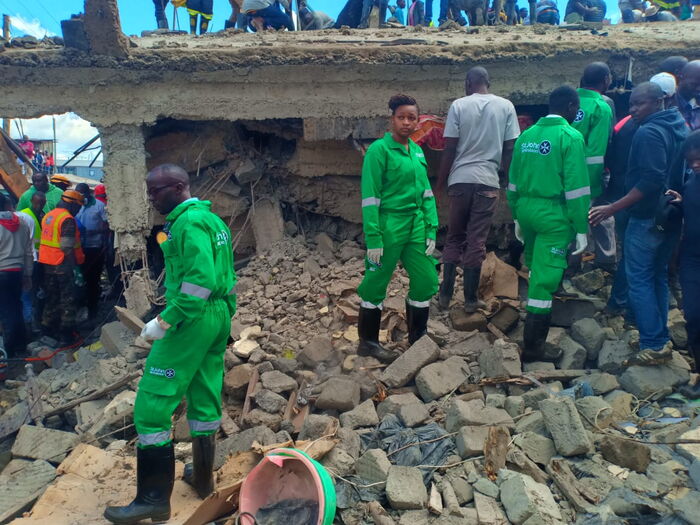 St John's Ambulance volunteers at the site of the collapsed building in Tassia, Embakasi on Friday, December 6, during the ongoing multi-agency rescue operations.