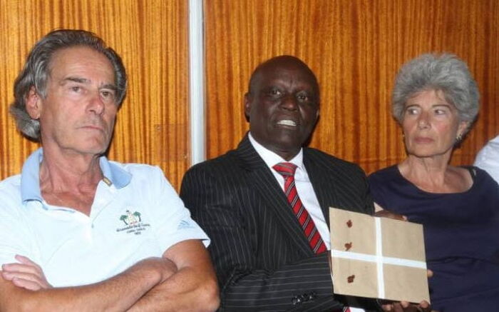 Chege Kirundi, lawyer for the Late Tob Cohen (centre) seated with Bernard Cohen and Gabrielle Cohen.