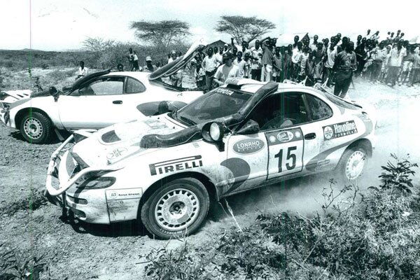 A crowd watches as Jonathan Toroitich, navigated by Ibrahim Choge, tackle a section of the Safari Rally route in Naivasha in 1997
