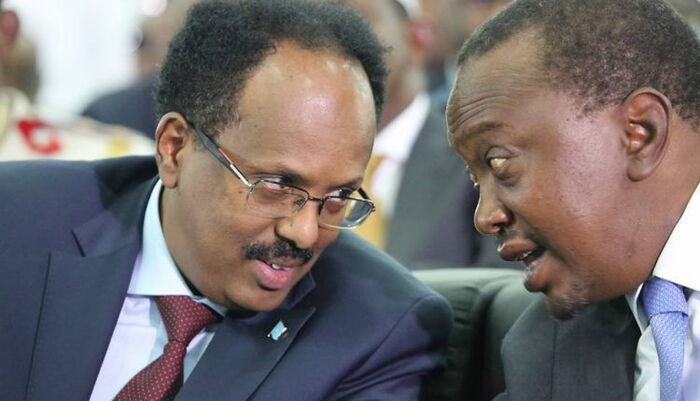 Kenyan President Uhuru Kenyatta and his Somalia counterpart Mohammed Farmajoo. The ICJ postponed the two countries' maritime border dispute case to June 8, 2020. Photo: File