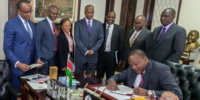 President Uhuru Kenyatta signs the interest rate Bill at State House in Nairobi on August 24, 2016. On Thursday, October 16, reports had it that he made a U-turn on the bill