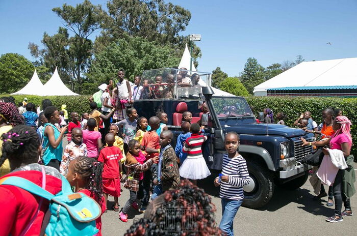 Children playing with the former presidents' official vehicle at Statehouse, Nairobi.