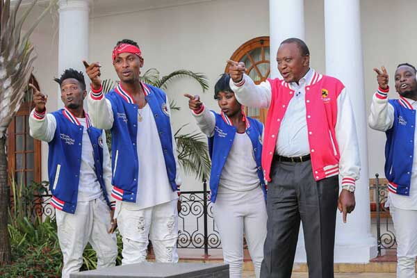 President Uhuru Kenyatta dances with FBI Crew at State House, Nairobi on February 8, 2017