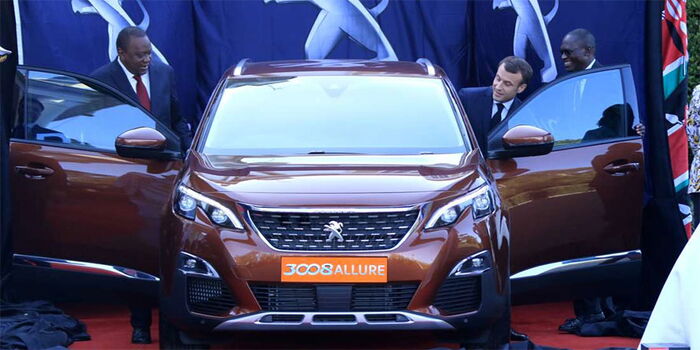 President Uhuru Kenyatta and France President Emmanuel Macron launch Peugeot 3008 SUV at State House, Nairobi on March 13, 2019.