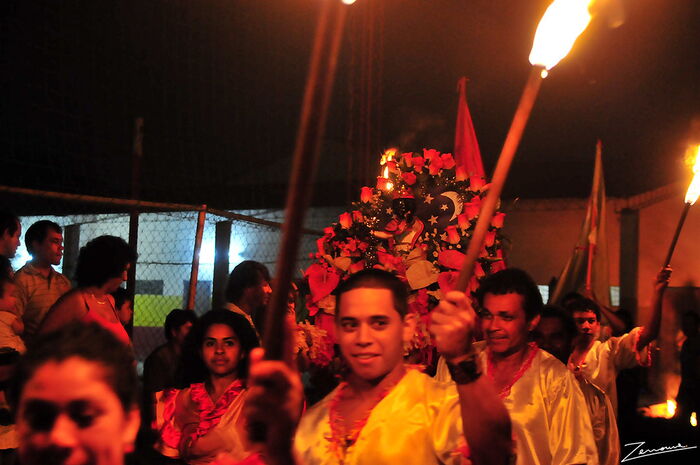 Members of the Kamba Cua community perform a traditional dance.