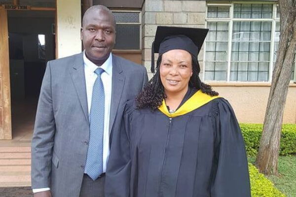 A photo of John Matiang'i with his wife during her 2016 graduation at UAEB. John is the KNUT treasurer