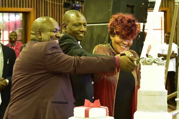Ruto cuts a cake with Bishop Pius Muiru and wife at Kasarani Sports Centre, Nairobi on Sunday, November 17, 2019, during the bishop's 25th anniversary of his ministry. 