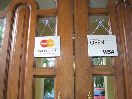 The VISA sign displayed at a restaurant door
