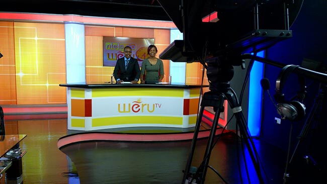 A photo of anchors presenting news at Weru TV.The station was launched in December 2016.