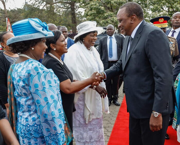 President Uhuru Kenyatta and his mother Ngina Kenyatta (in white) arriving at Jomo's 41st anniversary.
