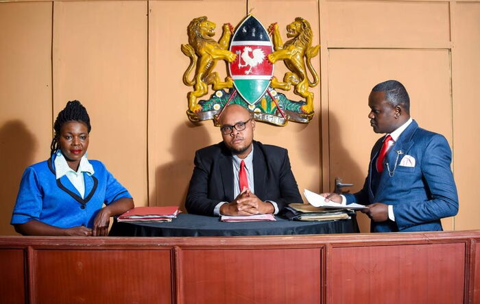 Dominion Silas(center) and Alliwah David(right) during an onset court session.