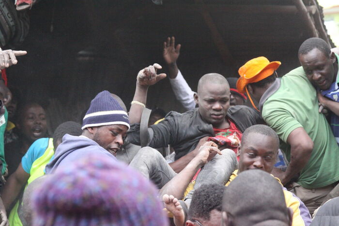 A man being lifted after being rescued from the collapsed building in Tasia on December 6. 