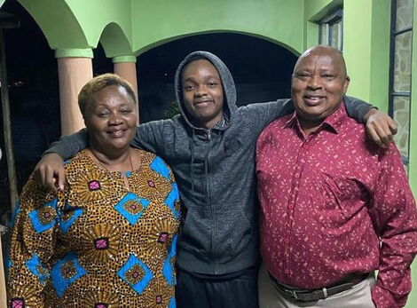 Jeremy Maina alias Lil Maina posing for a photo alongside his grandparents in June 2020.