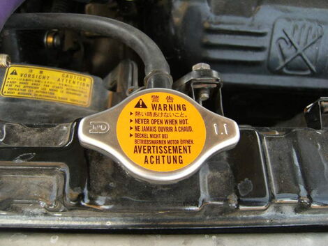 An image of a car's coolant lid.