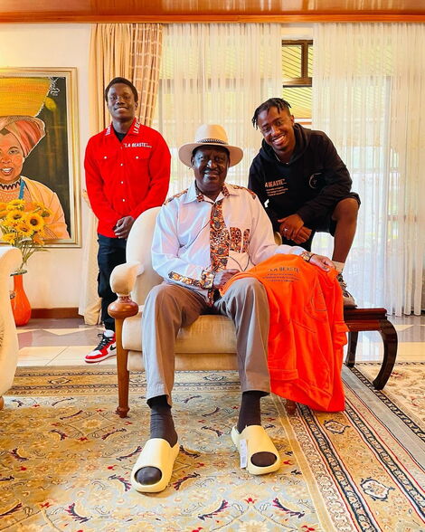A photo of Raila Odinga receiving merchandise from Ali Abdi together with his friend Harry at his Karen Residence on June 12