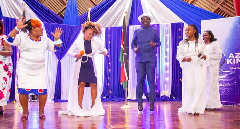 ODM Party Leader Raila Odinga dancing with other entertainers during the Azimio la Wamama Forum at CUEA on Thursday, November 18 2021.