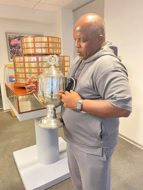 Elias Makori lifting a trophy as he toured the Boston Marathon in Nomber 13.