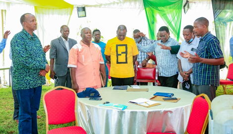 Deputy President William Ruto (in yellow Tshirt) and MP Aden Duale attend a clergy meeting in Garissa on Wednesday, December 22, 2021.
