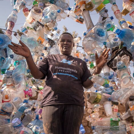A woman from Kibera, Nairobi County posing for a photo.